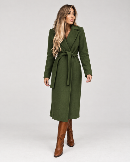 Woman wearing army green belted long wrap coat with boots