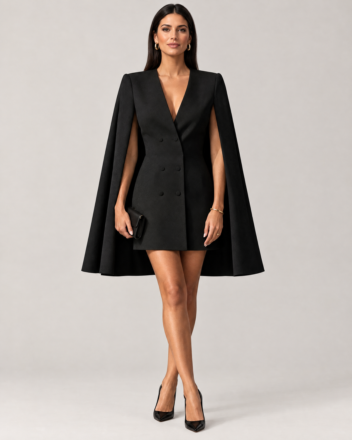 Woman wearing black cape blazer mini dress with heels