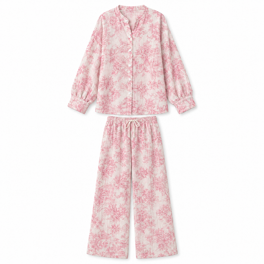 Women's pink floral print pajama set on white background
