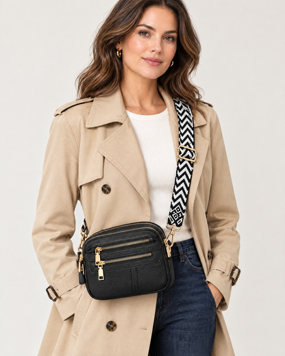 Woman wearing black multi-pocket crossbody bag
