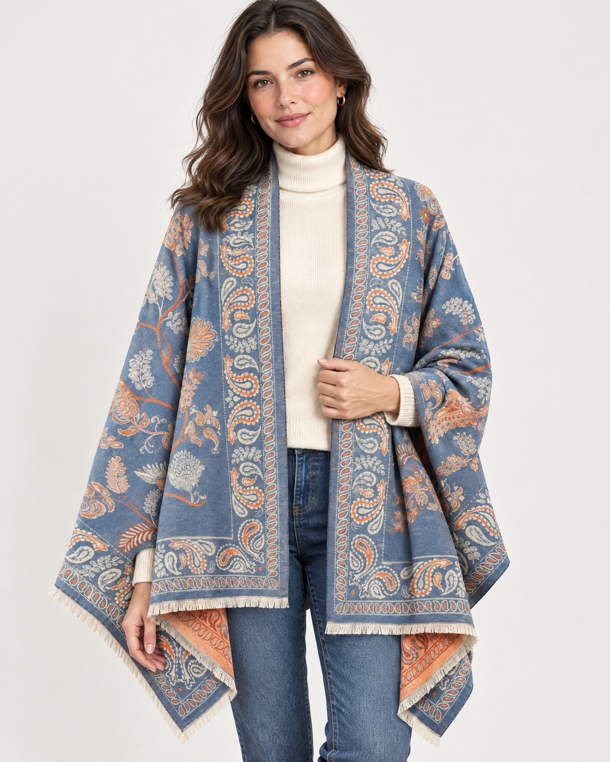 Woman wearing blue and orange paisley shawl wrap